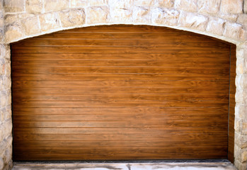 Wooden entrance in stone wall