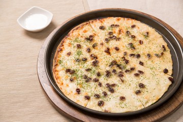Gorgonzola pizza on table