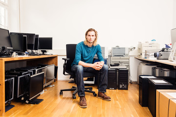 System Administrator With Lots Of Hardware, Computers And Monitors