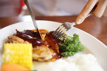 woman eating chicken-fried steak