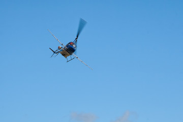 Fototapeta na wymiar helicopter flies in the sky