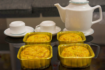 Vietnamese mid autumn festival cake. Mooncakes are traditional pastries eaten during the Mid-Autumn Festival. The festival involves family getting together to share mooncakes while watching the moon