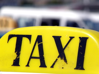 Yellow Taxi Sign from Close