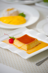 caramel pudding on a white plate