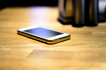 Phone on wooden table