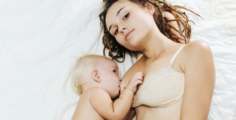 Mum feeds the child breast milk. Breastfeeding. The baby is very