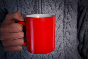 man holding tea cup