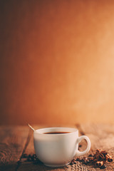 Coffee cup and saucer on a wooden table.