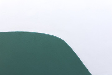 Green and white wall background in close up. Texture of house wall useful as background