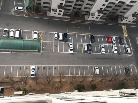 elevated view of parked cars in parking area
