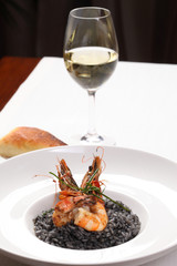 Fine dining - black risotto with shrimps