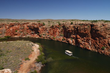 View of Yardie Creek Gorge with a tourist boat. Cape Range National Park in Western Australia, Australia
