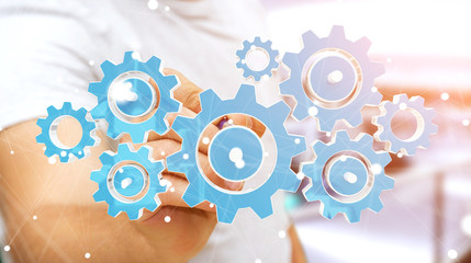 Businessman touching colorful gear icons with his finger 3D rend