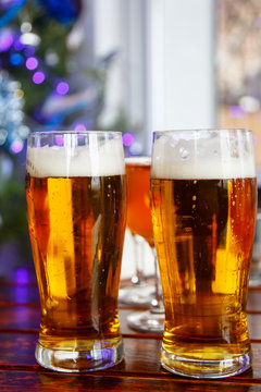 Two glasses of beer standing on the table