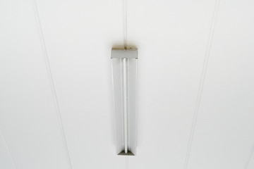 Fluorescent lamp at a white ceiling