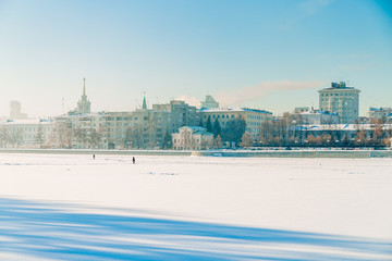 Naklejka premium Embankment in Yekaterinburg winter on a sunny day