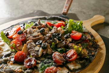 steak pizza on plate