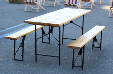 Folding table and benches on a street cafe