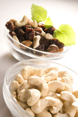 raisins, nuts mix, raisins, sunflower seeds in bowls 
