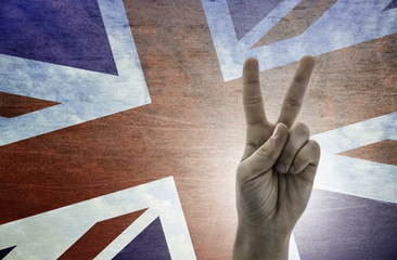 Victory symbol - two fingers against background of Great Britain