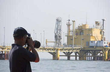 Blur cameraman was shooting the oil and gas industry