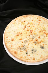 Quattro Formaggi pizza on dish