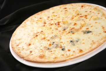 Quattro Formaggi pizza on dish