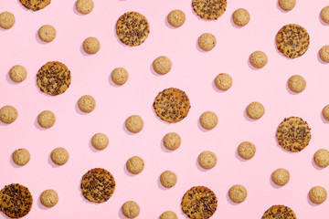 Pattern of sweet cookies on pink background