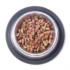 Dry cat food in a bowl. Top view