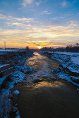 Winter sunrise on a river in Romania