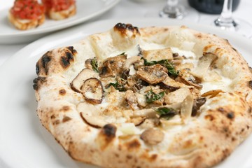 mushroom pizza on table