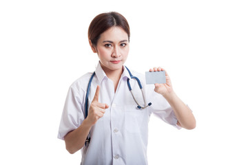 Asian young female doctor show one finger with blank card.