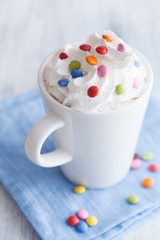 coffee with whipped cream and colorful chocolate drops