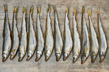 Salty stockfish on wooden table