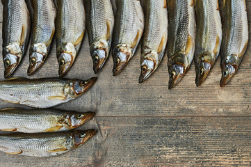 Salty stockfish on wooden table