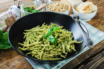 Trofie pasta with vegetarian sauce, pesto with pine nuts and bas - 133756086