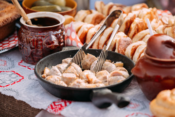 Dishes of the traditional Belarusian cuisine - fried bacon and meat
