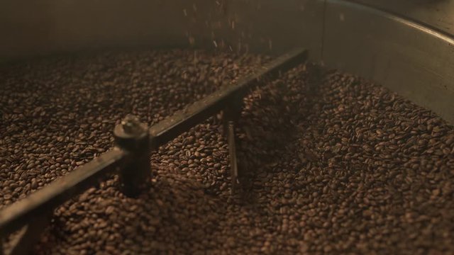 Coffee bean roaster at work in a production room