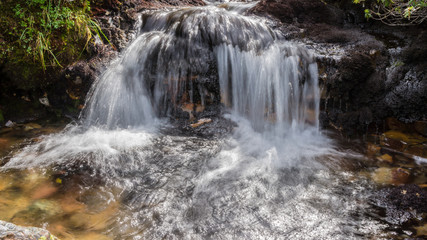 Fototapeta na wymiar Waterfall on the stream