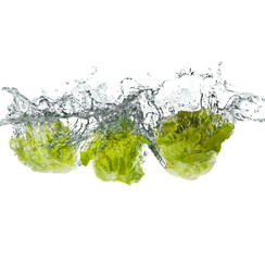 green salad vegetables making splash in water