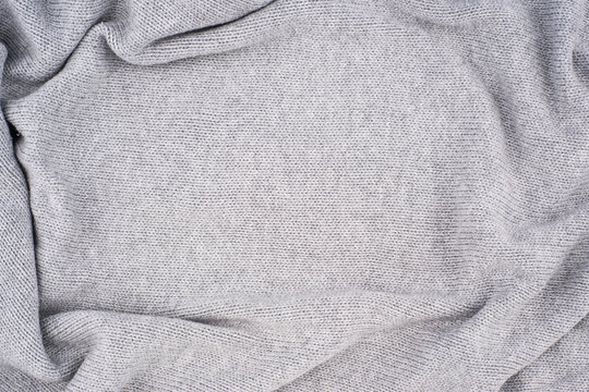 close up grey knitted pullover background.