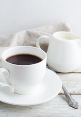 a coffee cup, coffee grains on a white background