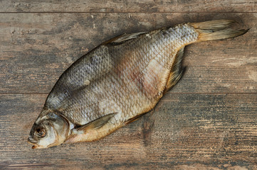 Salty stockfish on wooden table