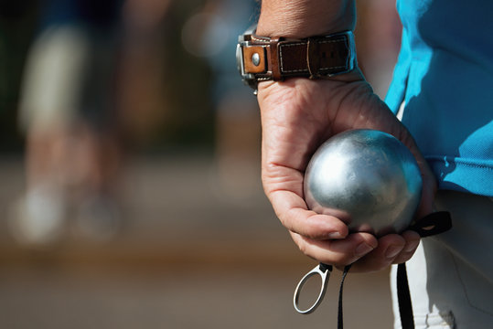 Hand of holding petanque ball,fun and relaxing game