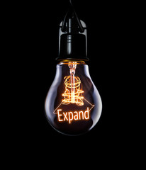 Hanging lightbulb with glowing Expand concept.
