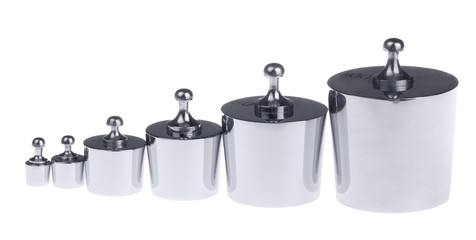 row of metall metering weights isolated on white