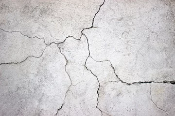 Foto op Canvas gebarsten betonnen muur bedekt met grijze cementtextuur als backgr © dmitr1ch