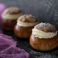 Fresh baked homemade buns on the table for breakfast Baking traditional Swedish semla bread