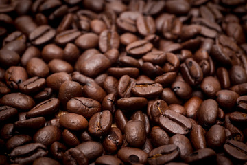 Organic coffee beans in background close up.
