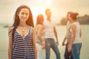 Group of Friends stay on the pier.